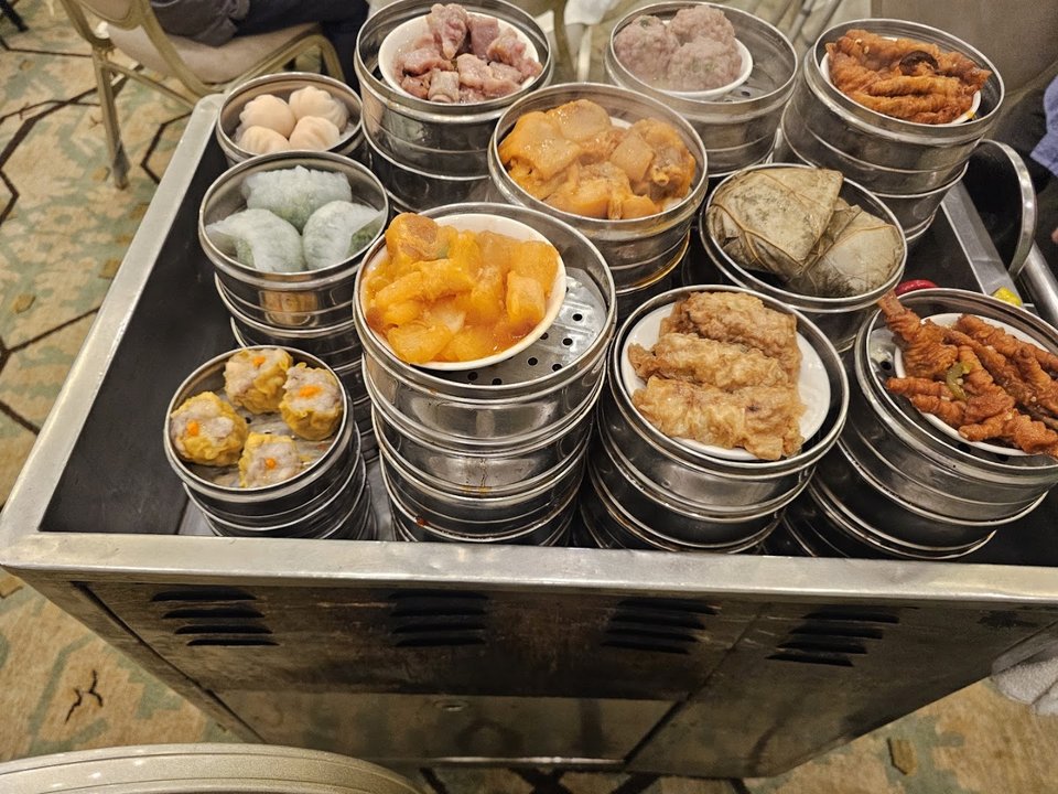 Dim sum plates on a restaurant table.